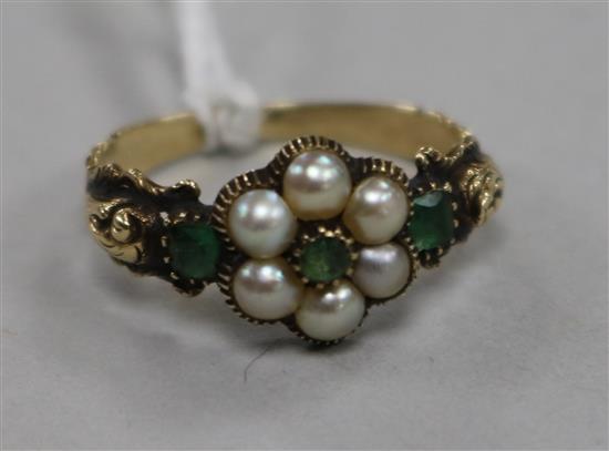 A 19th century yellow metal, emerald and split pearl cluster ring, size N.
